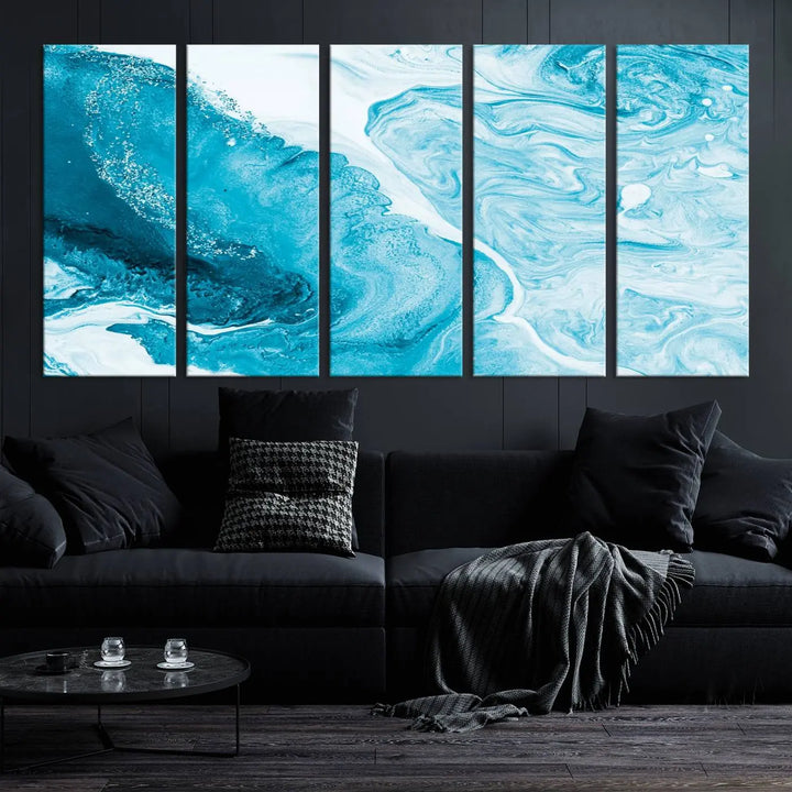 A modern living room showcasing the Bright Blue Marble Fluid Effect Wall Art Abstract Canvas, complete with a gallery-wrapped finish.