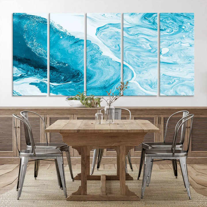 A modern living room showcasing the Bright Blue Marble Fluid Effect Wall Art Abstract Canvas, complete with a gallery-wrapped finish.