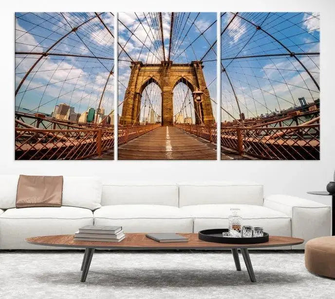 The Brooklyn Bridge Manhattan Wall Art Canvas Print, featuring three panels on museum-quality canvas with UV protection, hangs as an effortlessly elegant focal point in a minimalist living room.