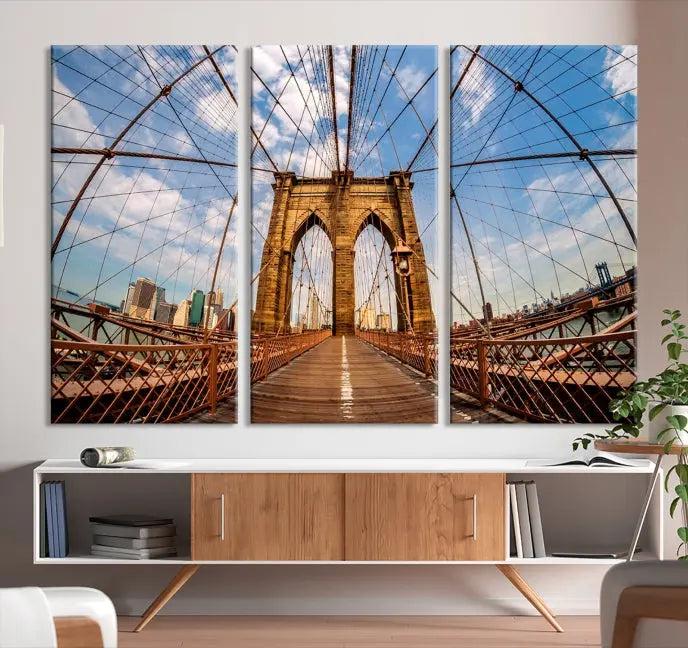 The Brooklyn Bridge Manhattan Wall Art Canvas Print, featuring three panels on museum-quality canvas with UV protection, hangs as an effortlessly elegant focal point in a minimalist living room.