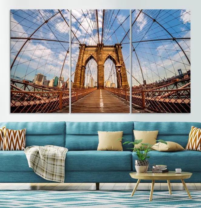 The Brooklyn Bridge Manhattan Wall Art Canvas Print, featuring three panels on museum-quality canvas with UV protection, hangs as an effortlessly elegant focal point in a minimalist living room.