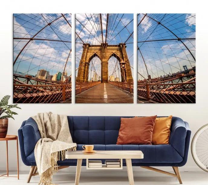 The Brooklyn Bridge Manhattan Wall Art Canvas Print, featuring three panels on museum-quality canvas with UV protection, hangs as an effortlessly elegant focal point in a minimalist living room.