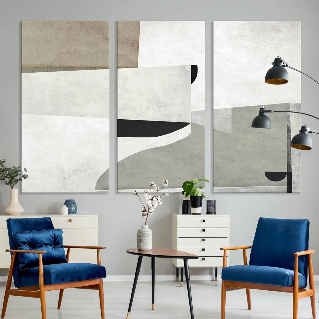 The Brown Gray Figures Abstract Wall Art Canvas Print is displayed as a triptych on a dark wall. The piece is gallery wrapped, offering a seamless finish and enhanced durability due to its UV-protective coating.