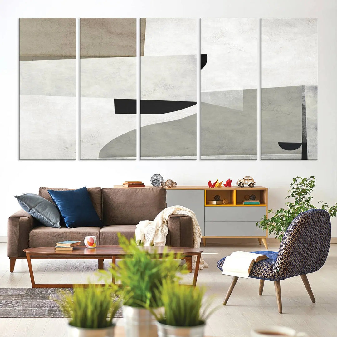 The Brown Gray Figures Abstract Wall Art Canvas Print is displayed as a triptych on a dark wall. The piece is gallery wrapped, offering a seamless finish and enhanced durability due to its UV-protective coating.