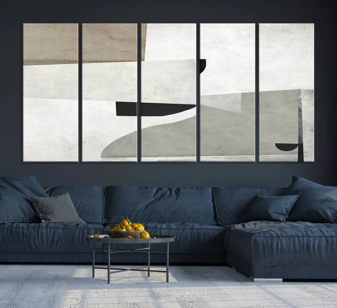 The Brown Gray Figures Abstract Wall Art Canvas Print is displayed as a triptych on a dark wall. The piece is gallery wrapped, offering a seamless finish and enhanced durability due to its UV-protective coating.