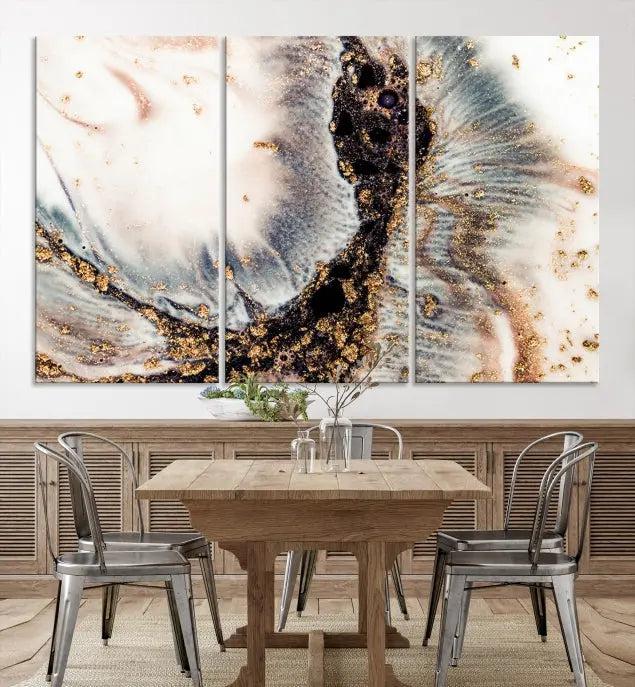 The Brown Marble Fluid Effect Wall Art Abstract Canvas Wall Art Print, with its mesmerizing black, white, and gold swirls, brings an exquisite touch to the space. This museum-quality canvas is elegantly displayed in a modern living room setting.