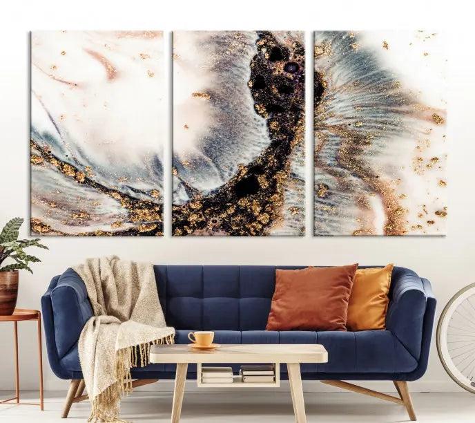 The Brown Marble Fluid Effect Wall Art Abstract Canvas Wall Art Print, with its mesmerizing black, white, and gold swirls, brings an exquisite touch to the space. This museum-quality canvas is elegantly displayed in a modern living room setting.