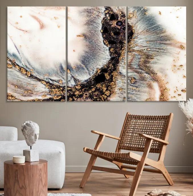 The Brown Marble Fluid Effect Wall Art Abstract Canvas Wall Art Print, with its mesmerizing black, white, and gold swirls, brings an exquisite touch to the space. This museum-quality canvas is elegantly displayed in a modern living room setting.