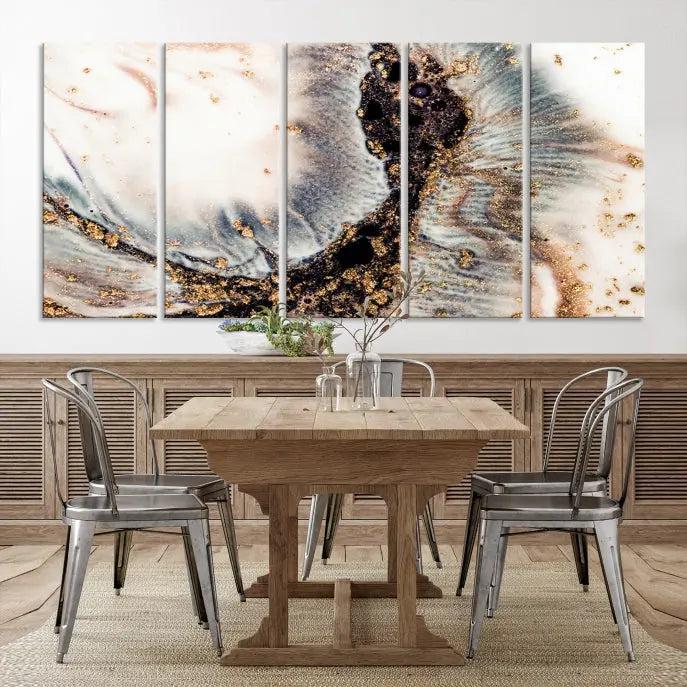 The Brown Marble Fluid Effect Wall Art Abstract Canvas Wall Art Print, with its mesmerizing black, white, and gold swirls, brings an exquisite touch to the space. This museum-quality canvas is elegantly displayed in a modern living room setting.