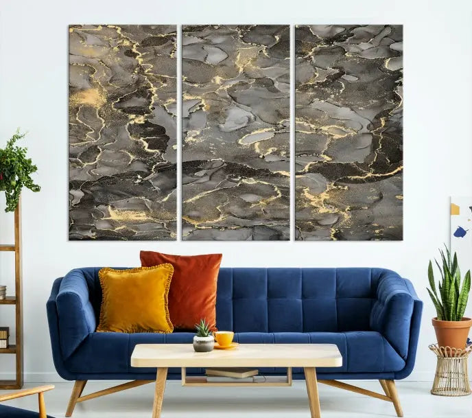 The Brown Yellow Marble Fluid Effect Abstract Canvas Wall Art Print, expertly wrapped on museum-quality canvas, enhances the dark wall with intricate gold and gray swirls.