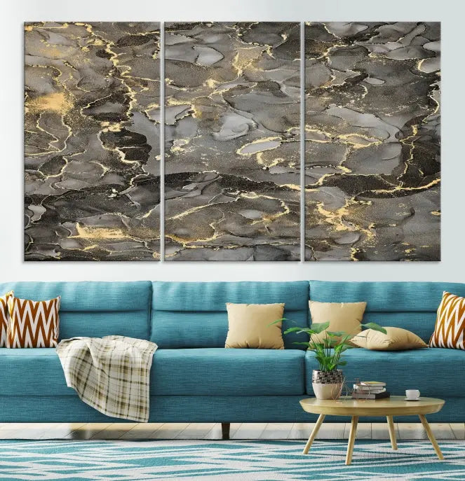 The Brown Yellow Marble Fluid Effect Abstract Canvas Wall Art Print, expertly wrapped on museum-quality canvas, enhances the dark wall with intricate gold and gray swirls.