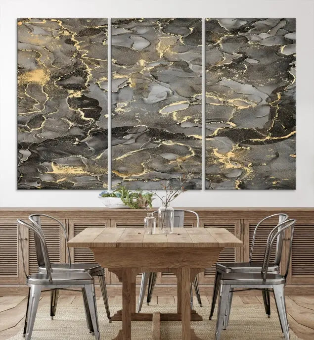 The Brown Yellow Marble Fluid Effect Abstract Canvas Wall Art Print, expertly wrapped on museum-quality canvas, enhances the dark wall with intricate gold and gray swirls.