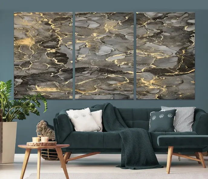 The Brown Yellow Marble Fluid Effect Abstract Canvas Wall Art Print, expertly wrapped on museum-quality canvas, enhances the dark wall with intricate gold and gray swirls.