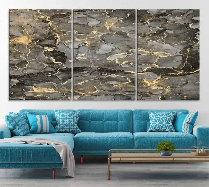 The Brown Yellow Marble Fluid Effect Abstract Canvas Wall Art Print, expertly wrapped on museum-quality canvas, enhances the dark wall with intricate gold and gray swirls.