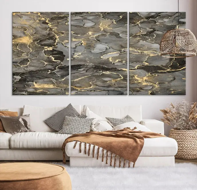 The Brown Yellow Marble Fluid Effect Abstract Canvas Wall Art Print, expertly wrapped on museum-quality canvas, enhances the dark wall with intricate gold and gray swirls.