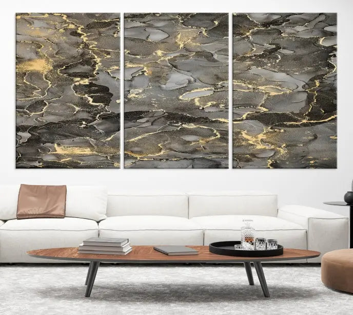 The Brown Yellow Marble Fluid Effect Abstract Canvas Wall Art Print, expertly wrapped on museum-quality canvas, enhances the dark wall with intricate gold and gray swirls.