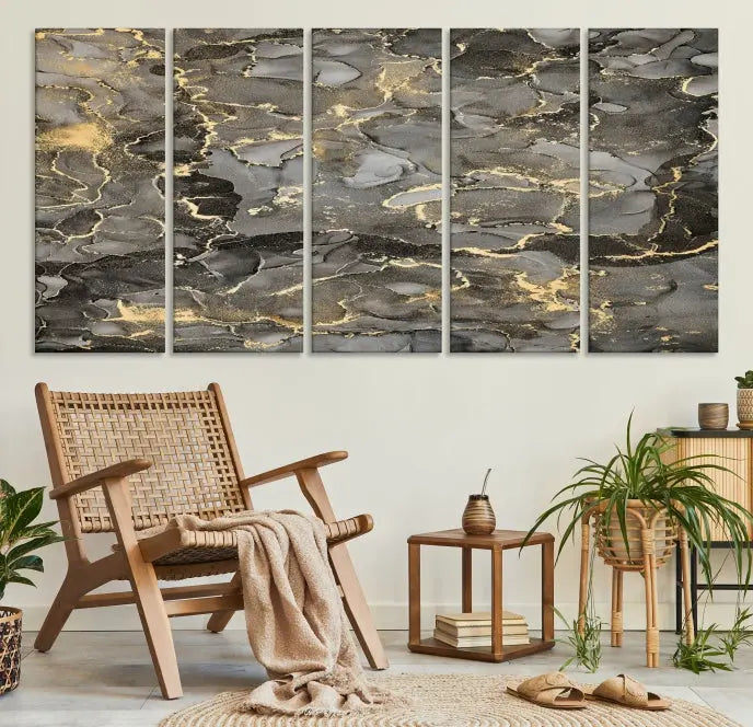 The Brown Yellow Marble Fluid Effect Abstract Canvas Wall Art Print, expertly wrapped on museum-quality canvas, enhances the dark wall with intricate gold and gray swirls.