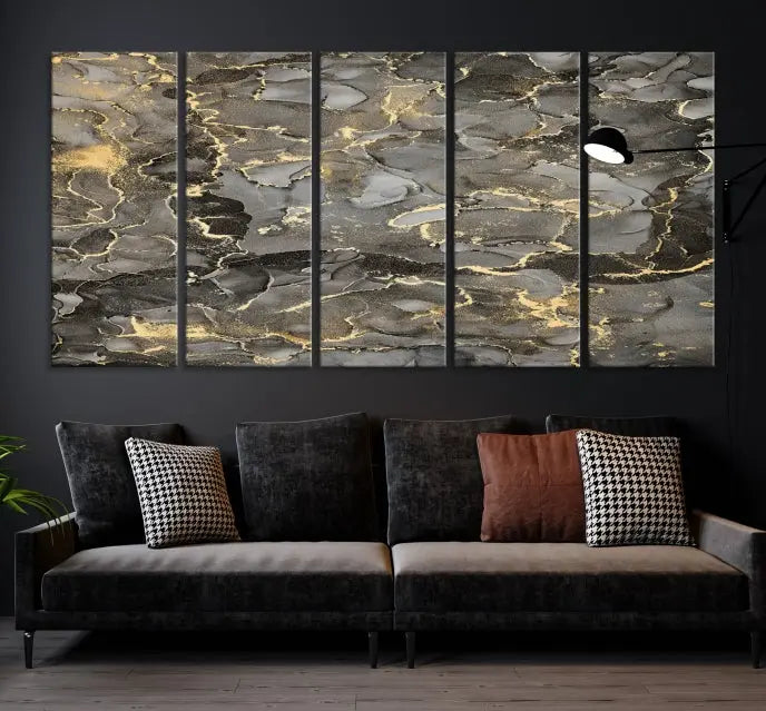 The Brown Yellow Marble Fluid Effect Abstract Canvas Wall Art Print, expertly wrapped on museum-quality canvas, enhances the dark wall with intricate gold and gray swirls.