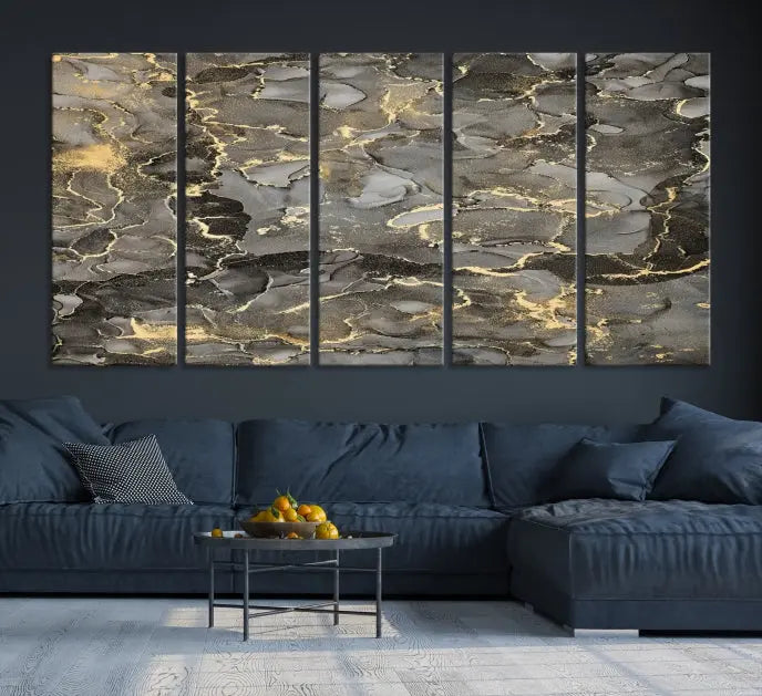 The Brown Yellow Marble Fluid Effect Abstract Canvas Wall Art Print, expertly wrapped on museum-quality canvas, enhances the dark wall with intricate gold and gray swirls.