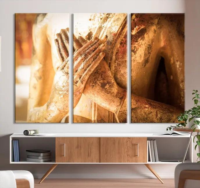 This Buddha Statue Hands Wall Art Canvas Print features a weathered golden Buddha statue with folded hands, crafted on museum-quality canvas and protected with a UV coating. Experience the elegance and tranquility of this piece with free shipping included.