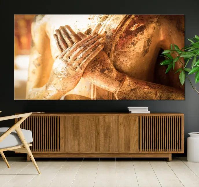 This Buddha Statue Hands Wall Art Canvas Print features a weathered golden Buddha statue with folded hands, crafted on museum-quality canvas and protected with a UV coating. Experience the elegance and tranquility of this piece with free shipping included.