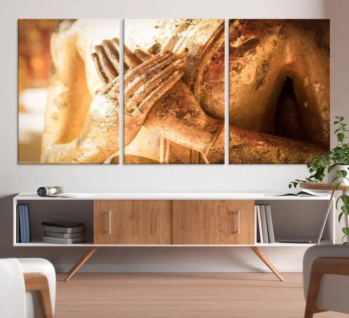 This Buddha Statue Hands Wall Art Canvas Print features a weathered golden Buddha statue with folded hands, crafted on museum-quality canvas and protected with a UV coating. Experience the elegance and tranquility of this piece with free shipping included.