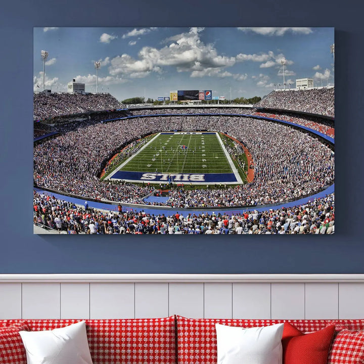 The wall features the Buffalo Bills Highmark Stadium Wall Art Canvas Print. This triple canvas captures the thrilling game day atmosphere of a packed football stadium during a Buffalo Bills NFL match.