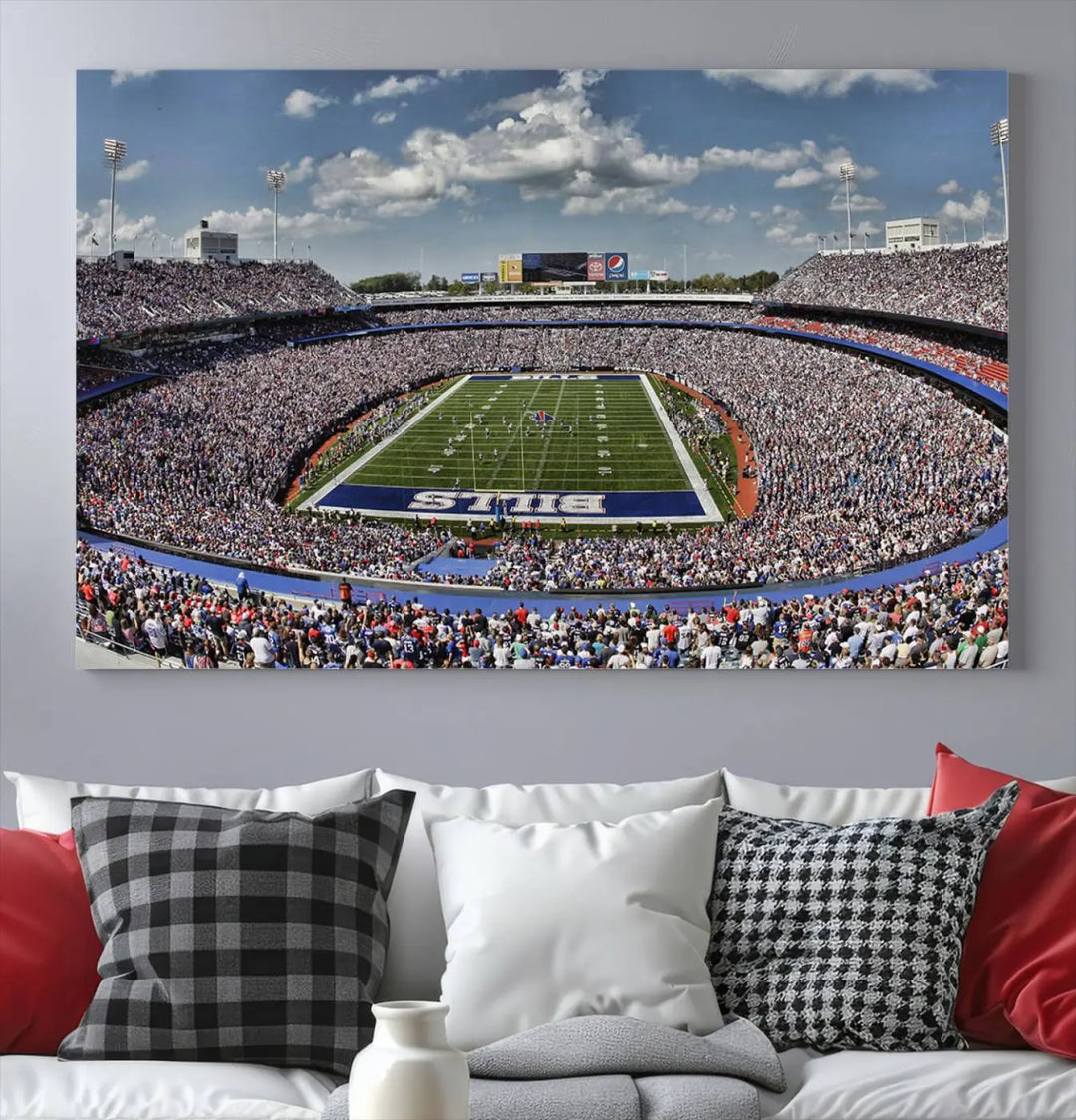 The wall features the Buffalo Bills Highmark Stadium Wall Art Canvas Print. This triple canvas captures the thrilling game day atmosphere of a packed football stadium during a Buffalo Bills NFL match.