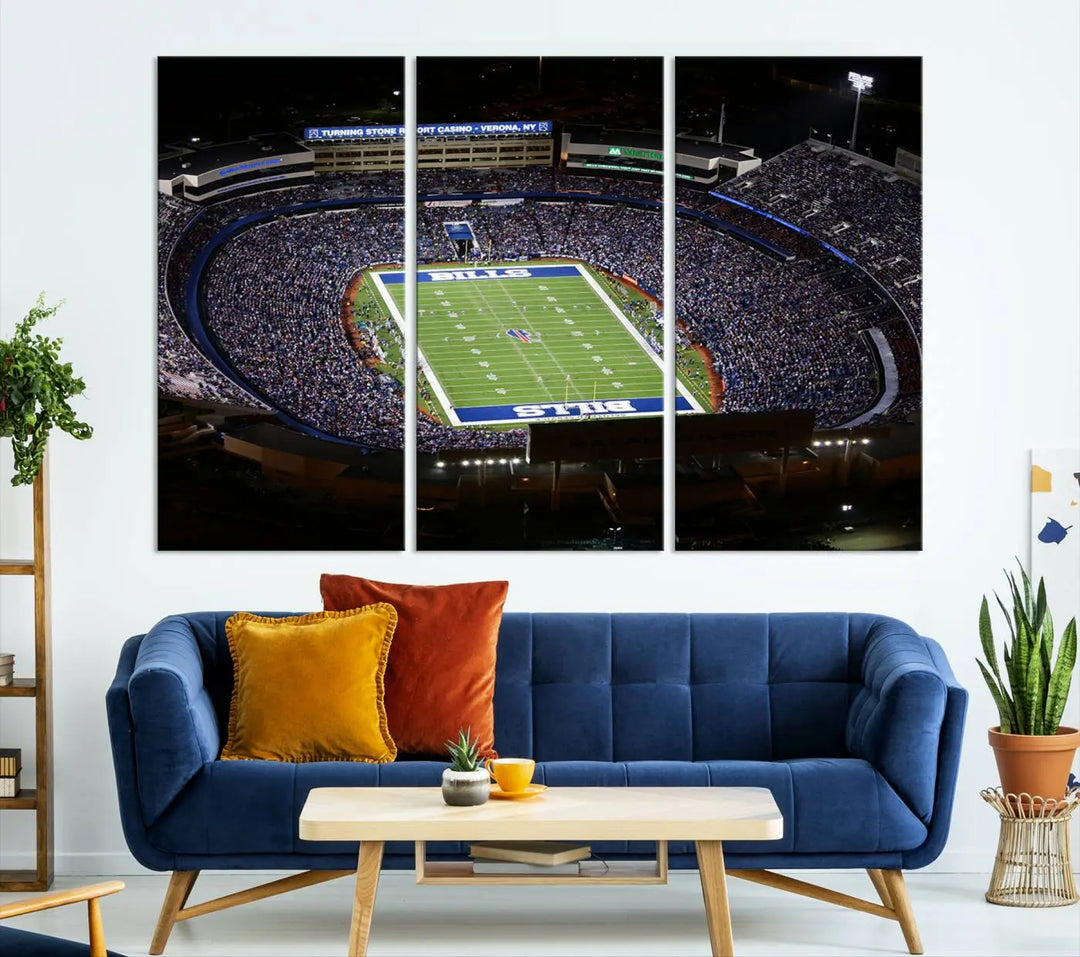 Above the couch hangs a museum-quality triptych featuring the Buffalo Bills NFL Football Team: a stunning canvas print of Highmark Stadium packed with enthusiastic spectators at night. The high-resolution printing technique captures every detail to perfection, making it ready to hang and instantly elevate any space.