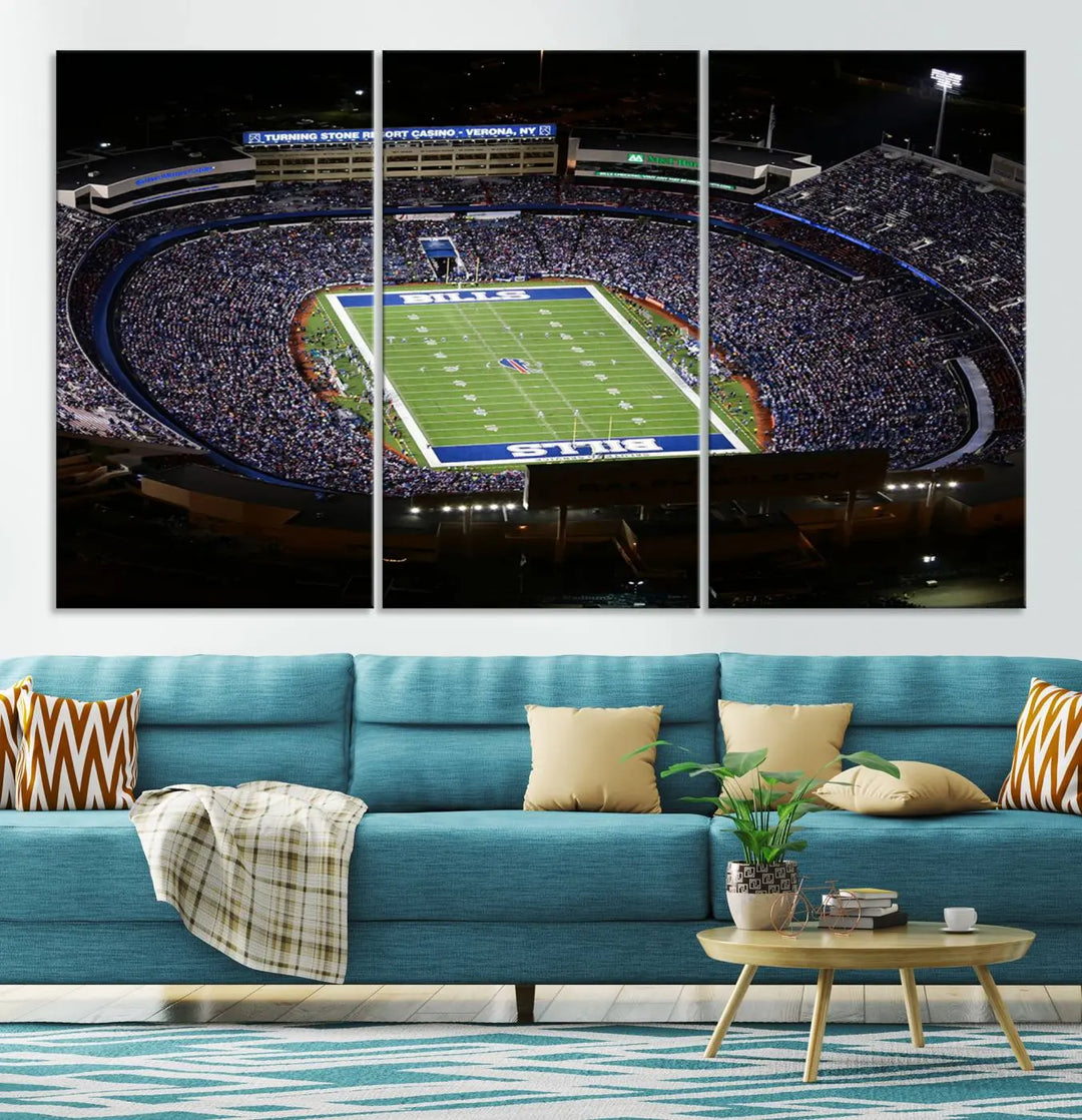 Above the couch hangs a museum-quality triptych featuring the Buffalo Bills NFL Football Team: a stunning canvas print of Highmark Stadium packed with enthusiastic spectators at night. The high-resolution printing technique captures every detail to perfection, making it ready to hang and instantly elevate any space.