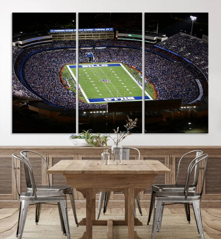 Above the couch hangs a museum-quality triptych featuring the Buffalo Bills NFL Football Team: a stunning canvas print of Highmark Stadium packed with enthusiastic spectators at night. The high-resolution printing technique captures every detail to perfection, making it ready to hang and instantly elevate any space.