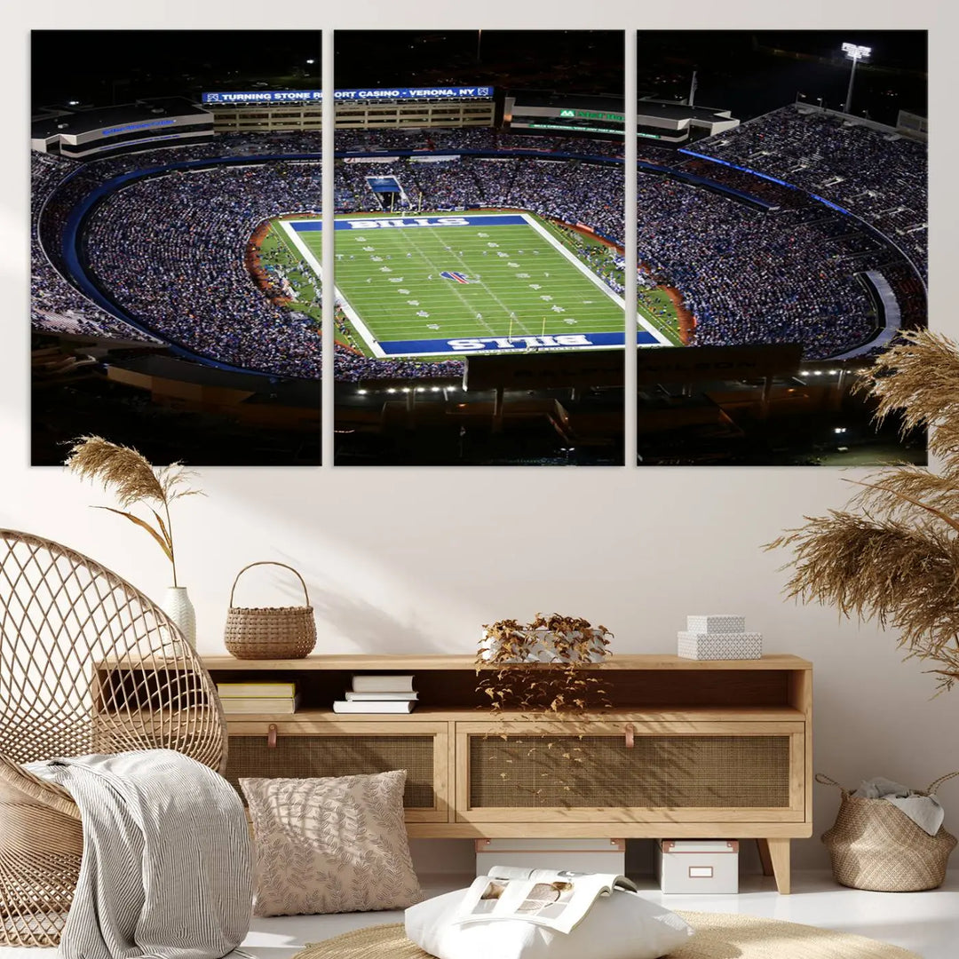 Above the couch hangs a museum-quality triptych featuring the Buffalo Bills NFL Football Team: a stunning canvas print of Highmark Stadium packed with enthusiastic spectators at night. The high-resolution printing technique captures every detail to perfection, making it ready to hang and instantly elevate any space.