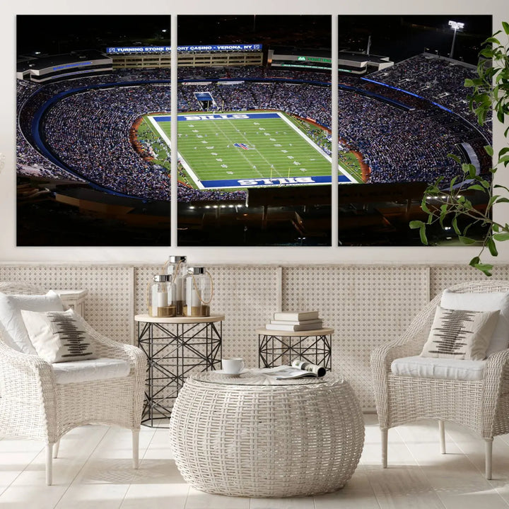 Above the couch hangs a museum-quality triptych featuring the Buffalo Bills NFL Football Team: a stunning canvas print of Highmark Stadium packed with enthusiastic spectators at night. The high-resolution printing technique captures every detail to perfection, making it ready to hang and instantly elevate any space.