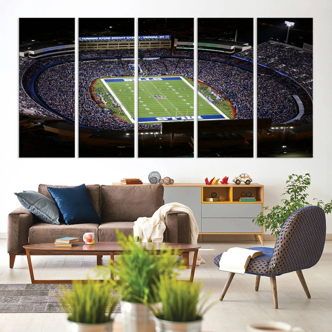 Above the couch hangs a museum-quality triptych featuring the Buffalo Bills NFL Football Team: a stunning canvas print of Highmark Stadium packed with enthusiastic spectators at night. The high-resolution printing technique captures every detail to perfection, making it ready to hang and instantly elevate any space.