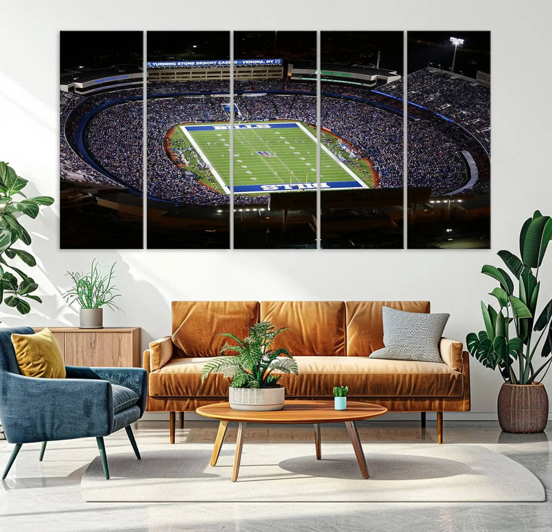 Above the couch hangs a museum-quality triptych featuring the Buffalo Bills NFL Football Team: a stunning canvas print of Highmark Stadium packed with enthusiastic spectators at night. The high-resolution printing technique captures every detail to perfection, making it ready to hang and instantly elevate any space.