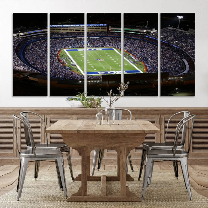 Above the couch hangs a museum-quality triptych featuring the Buffalo Bills NFL Football Team: a stunning canvas print of Highmark Stadium packed with enthusiastic spectators at night. The high-resolution printing technique captures every detail to perfection, making it ready to hang and instantly elevate any space.