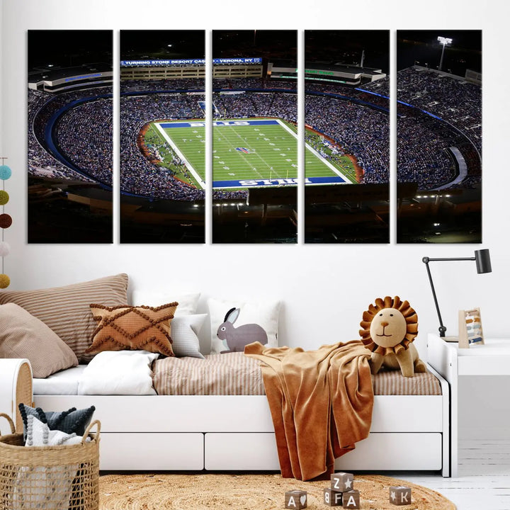 Above the couch hangs a museum-quality triptych featuring the Buffalo Bills NFL Football Team: a stunning canvas print of Highmark Stadium packed with enthusiastic spectators at night. The high-resolution printing technique captures every detail to perfection, making it ready to hang and instantly elevate any space.