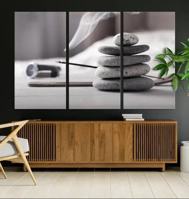 The "Burning Incense and Zen Stones Buddhism Wall Art Canvas Print" adds an artistic touch to the contemporary living room with its museum-quality depiction of stacked stones and incense smoke.