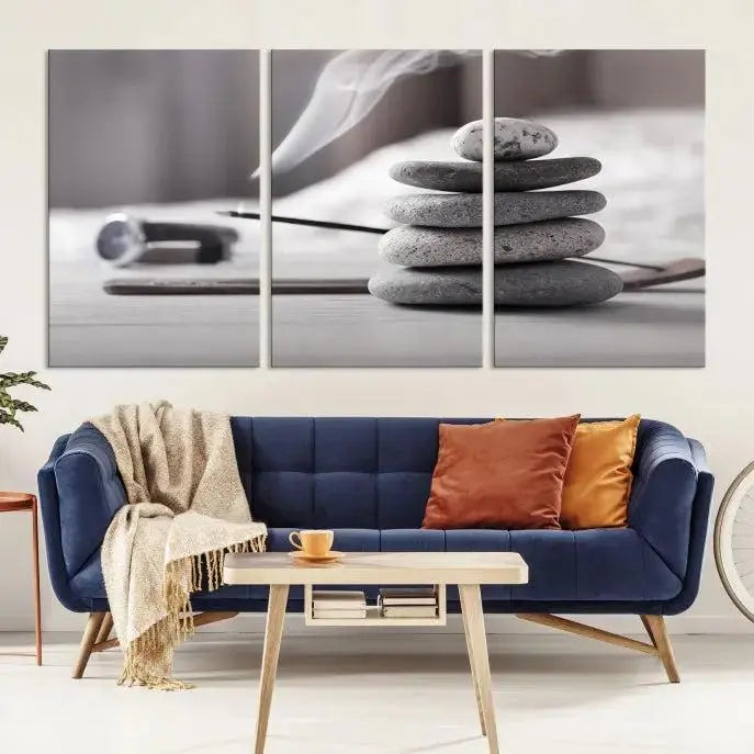 The "Burning Incense and Zen Stones Buddhism Wall Art Canvas Print" adds an artistic touch to the contemporary living room with its museum-quality depiction of stacked stones and incense smoke.