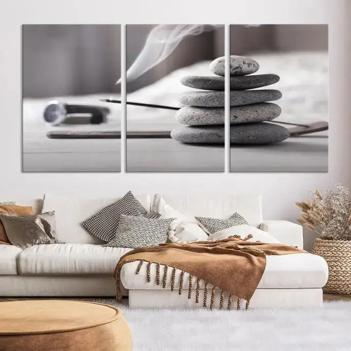 The "Burning Incense and Zen Stones Buddhism Wall Art Canvas Print" adds an artistic touch to the contemporary living room with its museum-quality depiction of stacked stones and incense smoke.