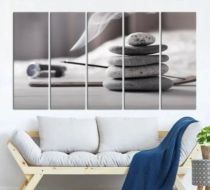 The "Burning Incense and Zen Stones Buddhism Wall Art Canvas Print" adds an artistic touch to the contemporary living room with its museum-quality depiction of stacked stones and incense smoke.