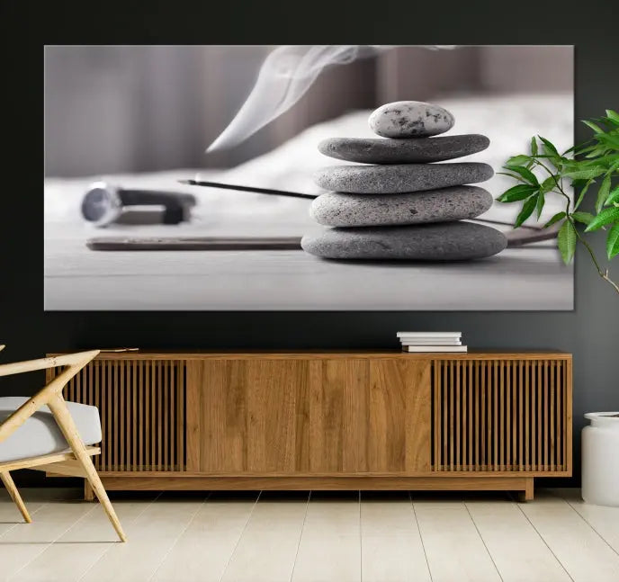 The "Burning Incense and Zen Stones Buddhism Wall Art Canvas Print" adds an artistic touch to the contemporary living room with its museum-quality depiction of stacked stones and incense smoke.