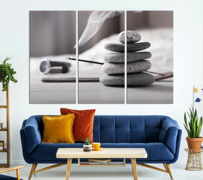 The "Burning Incense and Zen Stones Buddhism Wall Art Canvas Print" adds an artistic touch to the contemporary living room with its museum-quality depiction of stacked stones and incense smoke.