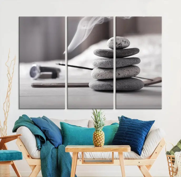 The "Burning Incense and Zen Stones Buddhism Wall Art Canvas Print" adds an artistic touch to the contemporary living room with its museum-quality depiction of stacked stones and incense smoke.