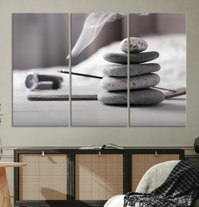 The "Burning Incense and Zen Stones Buddhism Wall Art Canvas Print" adds an artistic touch to the contemporary living room with its museum-quality depiction of stacked stones and incense smoke.