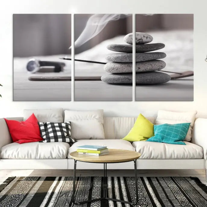 The "Burning Incense and Zen Stones Buddhism Wall Art Canvas Print" adds an artistic touch to the contemporary living room with its museum-quality depiction of stacked stones and incense smoke.