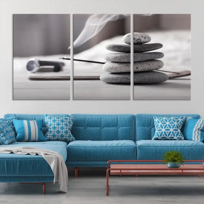 The "Burning Incense and Zen Stones Buddhism Wall Art Canvas Print" adds an artistic touch to the contemporary living room with its museum-quality depiction of stacked stones and incense smoke.