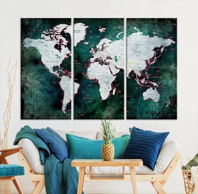 A stylish living room showcases a triptych 'Canvas World Map' on gallery-wrapped, museum-quality canvases decorating the wall.