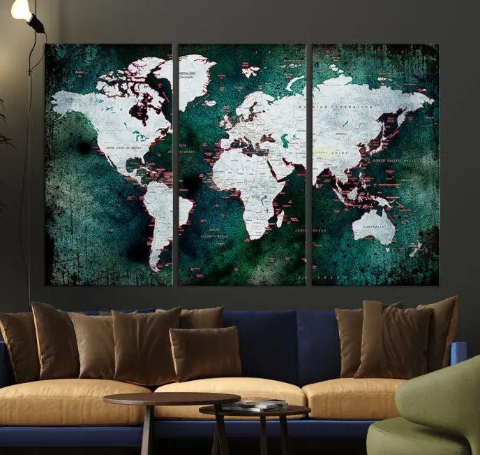 A stylish living room showcases a triptych 'Canvas World Map' on gallery-wrapped, museum-quality canvases decorating the wall.