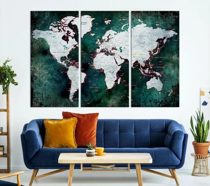 A stylish living room showcases a triptych 'Canvas World Map' on gallery-wrapped, museum-quality canvases decorating the wall.